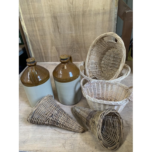 890 - Two 2 gallon Stoneware jars marked Pearson's and five wicker baskets