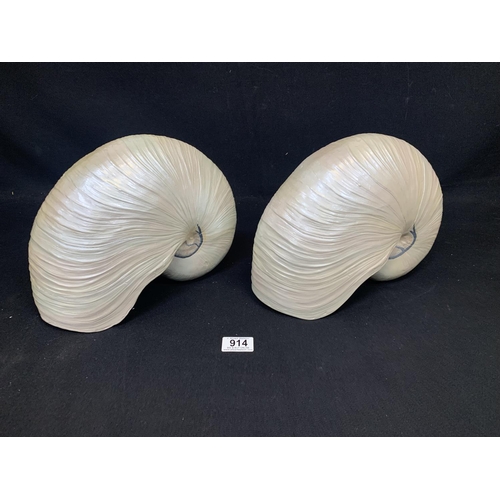 914 - Two giant pearl effect escargot shells, width 30 cms