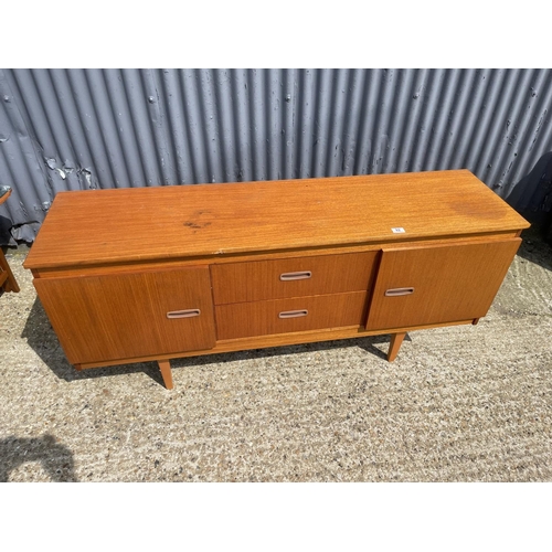 92 - A mid century compact teak sideboard 153 wide