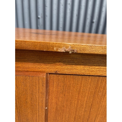 92 - A mid century compact teak sideboard 153 wide