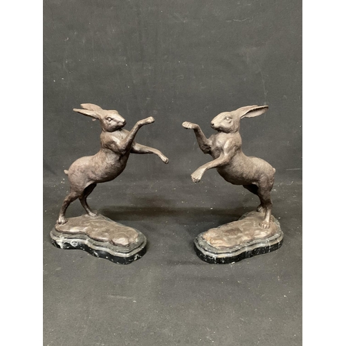 987 - Pair of Bronze Boxing hares on marble bases, height 28 cms