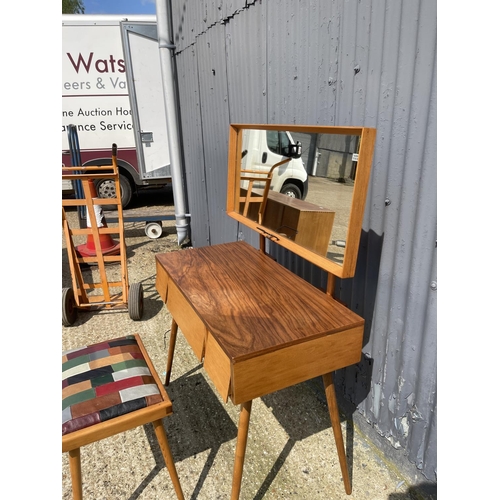 99 - AN unusual mid century teak three drawer dressing table / desk together with stool