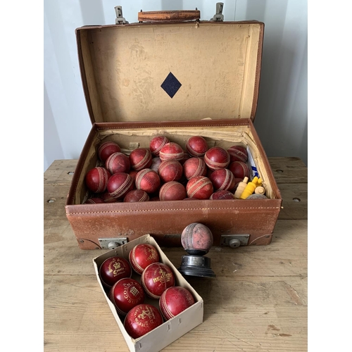 1004 - Vintage expanding leather case, cricket ball trophy and over 50 leather cricket balls