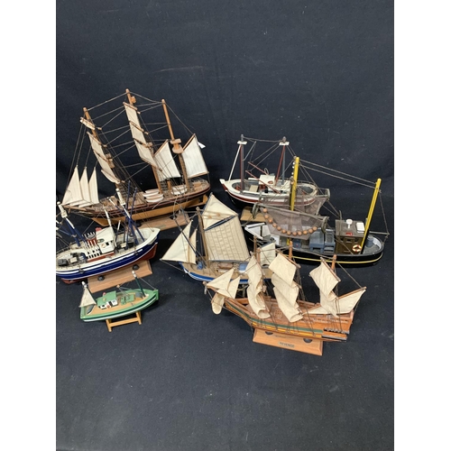 1014 - Seven wooden model ships