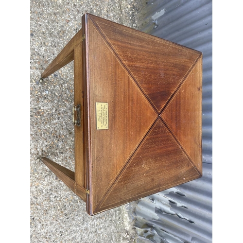 104 - An Edwardian mahogany envelope card table with presentation plaque 55x55x 75