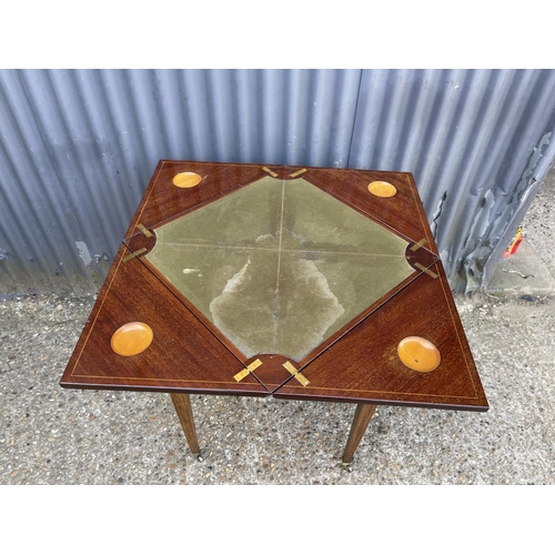 104 - An Edwardian mahogany envelope card table with presentation plaque 55x55x 75