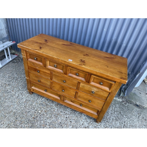 12 - A modern solid pine chest of 12 drawers