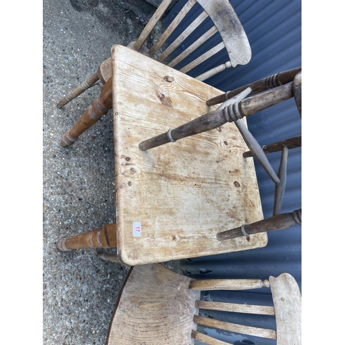 17 - A small square pine kitchen table together with three assorted kitchen chairs