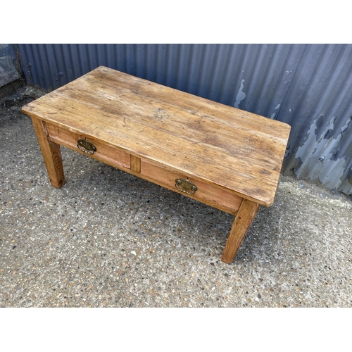 18 - A solid Pine farmhouse coffee table with two drawers 117x61x51