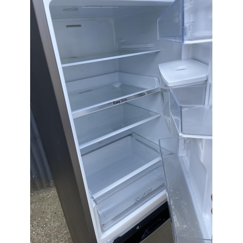 2 - A modern Samsung brushed steel fridge freeezer with weather dispenser