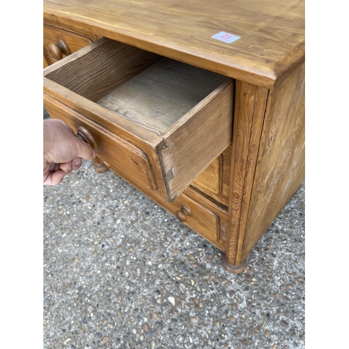 23 - A solid pine chest of four drawers 88x50x77