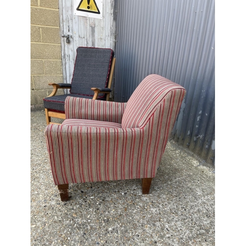 25 - A teak framed armchair with modern grey upholstery together with a modern stripe pattern armchair