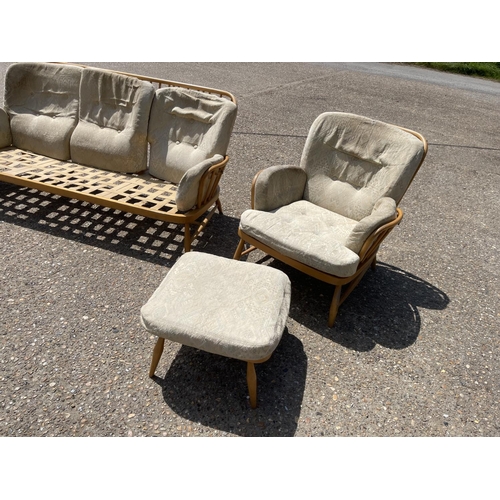 39 - An ercol four piece lounge suite for refurbishment including a sofa, two chairs and a footstool, som... 