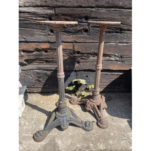 396 - A pair of cast iron table bases