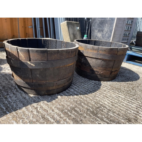 398 - A pair of Scottish oak half whisky barrel planters