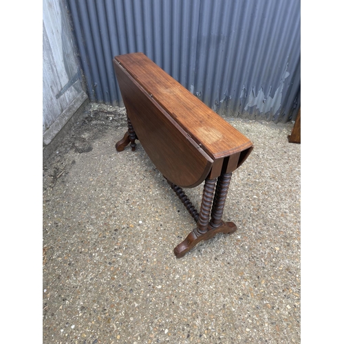 49 - A early 20th century barley twist teak gate leg table 117 diameter 77 high