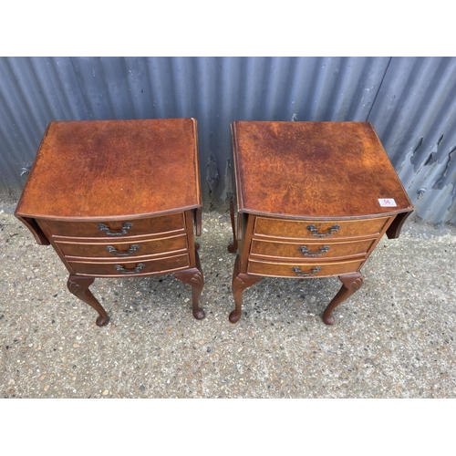 56 - A pair of walnut drop leaf chests of three drawers