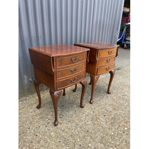 56 - A pair of walnut drop leaf chests of three drawers