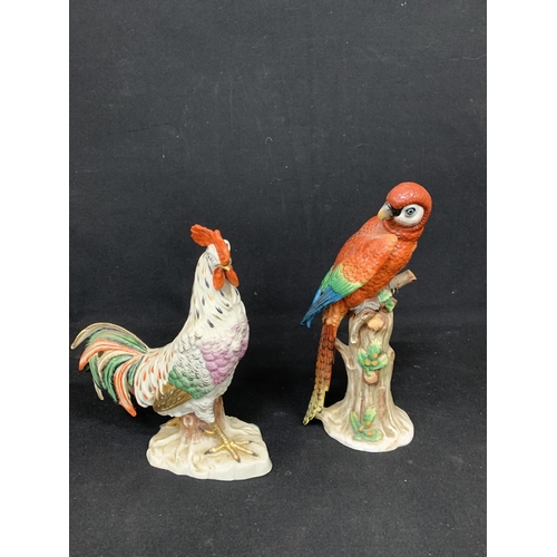 575 - Porcelain cockerel Figure with gold anchor mark and porcelain parrot Figure, height 29cms