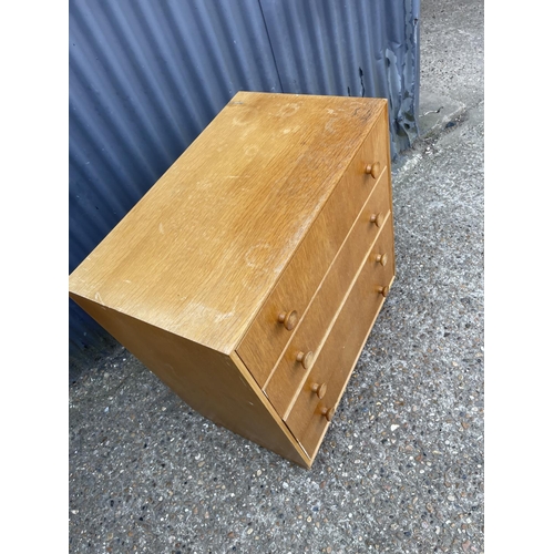 68 - A mid century light oak chest of four drawers 76x 46x85