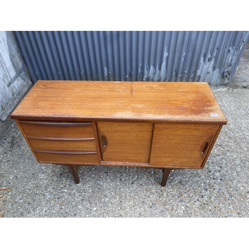 75 - A mid century compact sized teak sideboard  120x 40x75