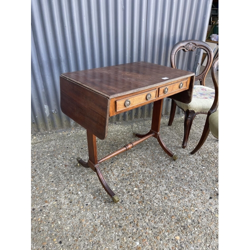 9 - A mahogany sofa table and two balloon back chairs