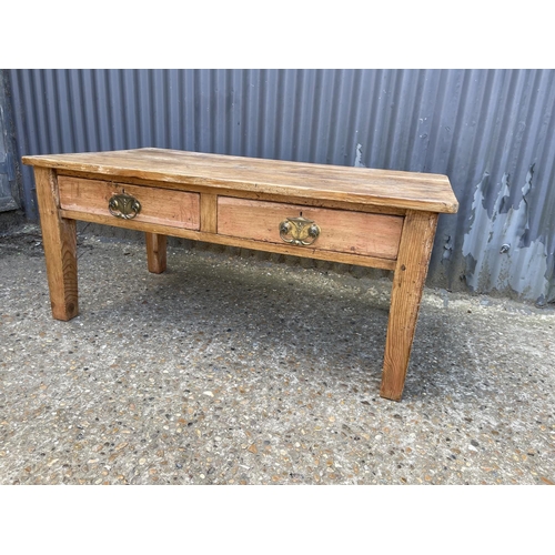 102 - A solid Pine farmhouse coffee table with two drawers 117x61x51