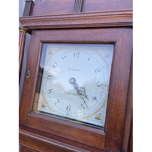 103 - An oak cased long-case clock by ELLIOT OF ASHFORD with two weights and pendulum