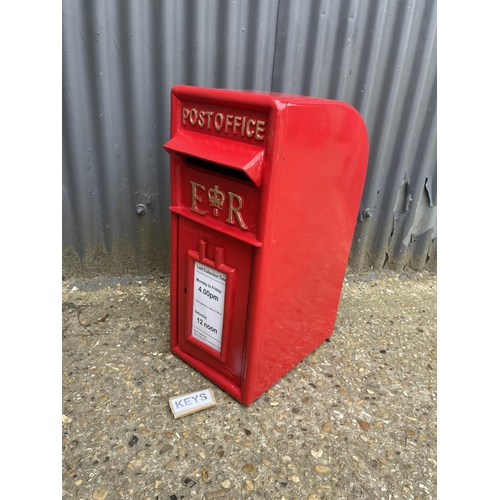 112 - A reproduction red iron letterbox with two keys