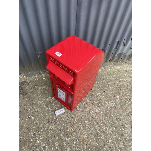 112 - A reproduction red iron letterbox with two keys