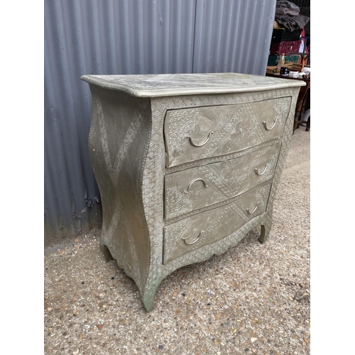 132 - A large chest of three covered in decorative brass 90x45 x90 together with matching chair