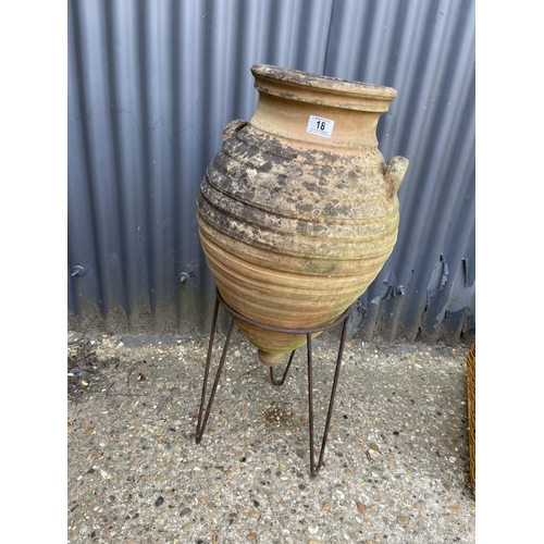 18 - A terracotta grecian style urn on stand