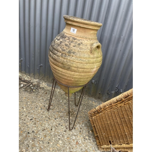 18 - A terracotta grecian style urn on stand