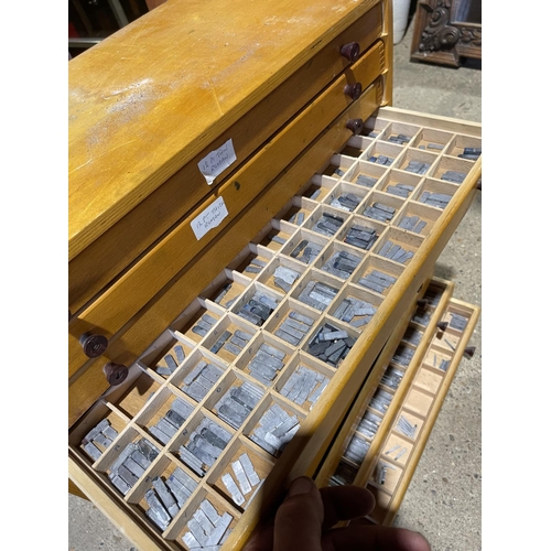 208 - Four banks of drawers all loaded with lead printing punches