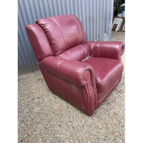 21 - A good quality red leather armchair