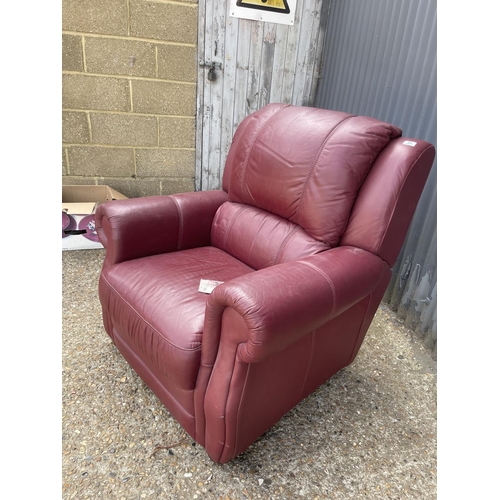 21 - A good quality red leather armchair