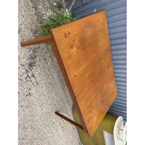 211 - A mid century teak dining table by white and newton