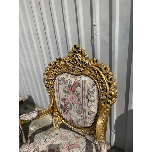 23 - A pair of gold gilt framed throne chairs with ornate decoration and tapestry upholstery