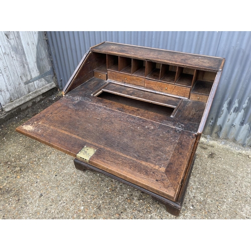 239 - Antique  oak bureau, fitted to the interior with drawers and well 92cm wide