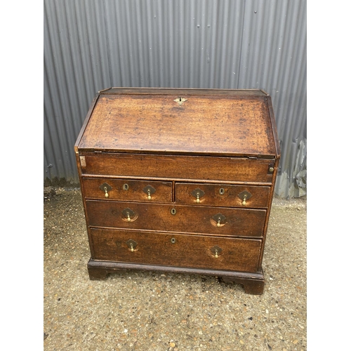 239 - Antique  oak bureau, fitted to the interior with drawers and well 92cm wide