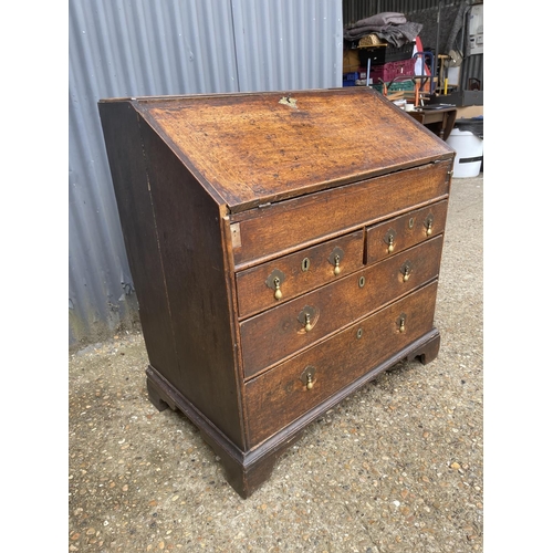 239 - Antique  oak bureau, fitted to the interior with drawers and well 92cm wide