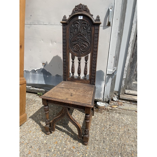 26 - An antique carved oak hall seat