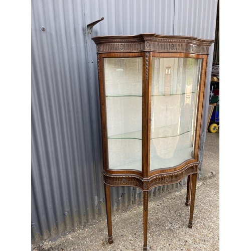 27 - A french mahogany display cabinet on stand, carved decoration with bow glass panels and door 120x40x... 