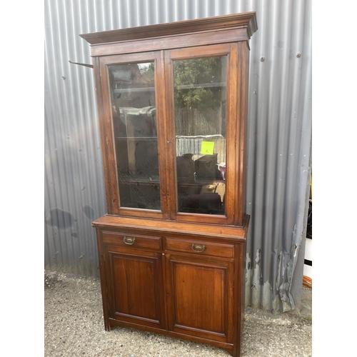 3 - An Edwardian mahogany bookcase cupboard  105x40x210