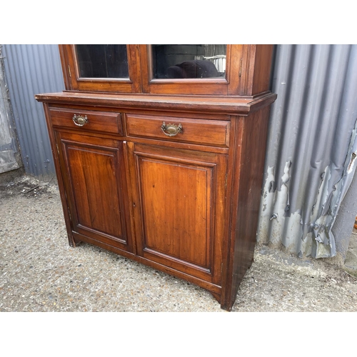 3 - An Edwardian mahogany bookcase cupboard  105x40x210