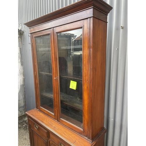 3 - An Edwardian mahogany bookcase cupboard  105x40x210