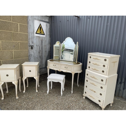 30 - A french style white painted bedroom suite consisting of a tallboy, a dressing table with leather to... 