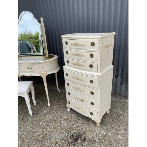 30 - A french style white painted bedroom suite consisting of a tallboy, a dressing table with leather to... 