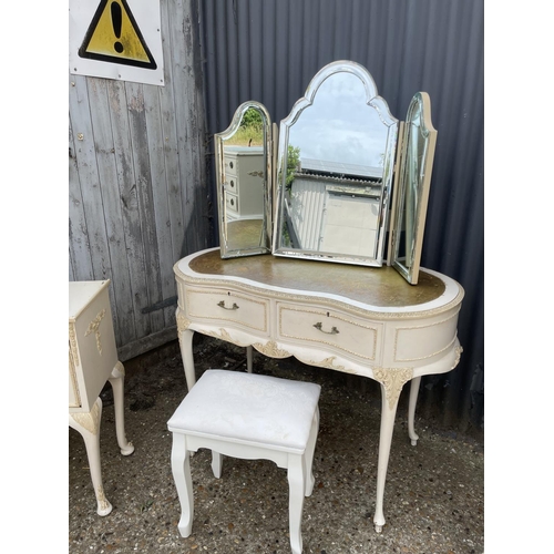 30 - A french style white painted bedroom suite consisting of a tallboy, a dressing table with leather to... 