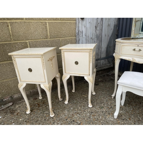 30 - A french style white painted bedroom suite consisting of a tallboy, a dressing table with leather to... 